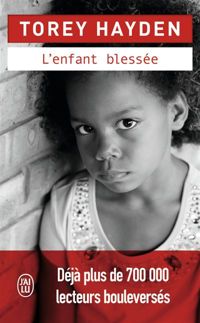 Couverture du livre L'enfant blessée - Torey Hayden - Eveline Charles